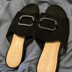 Black mules with square accessory
